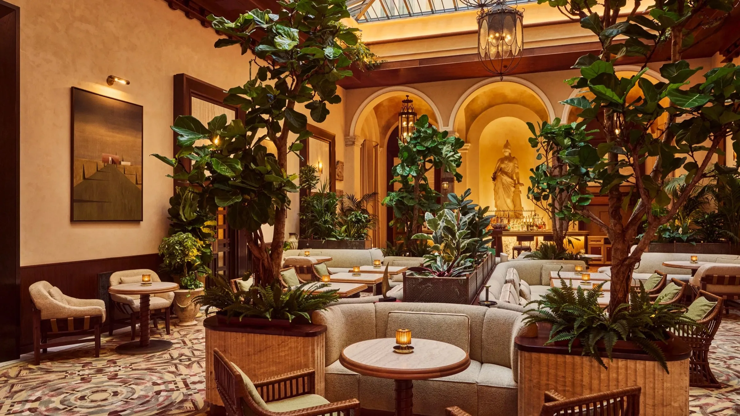 The bar at La Minerva, a winter garden of fig trees under a glass roof