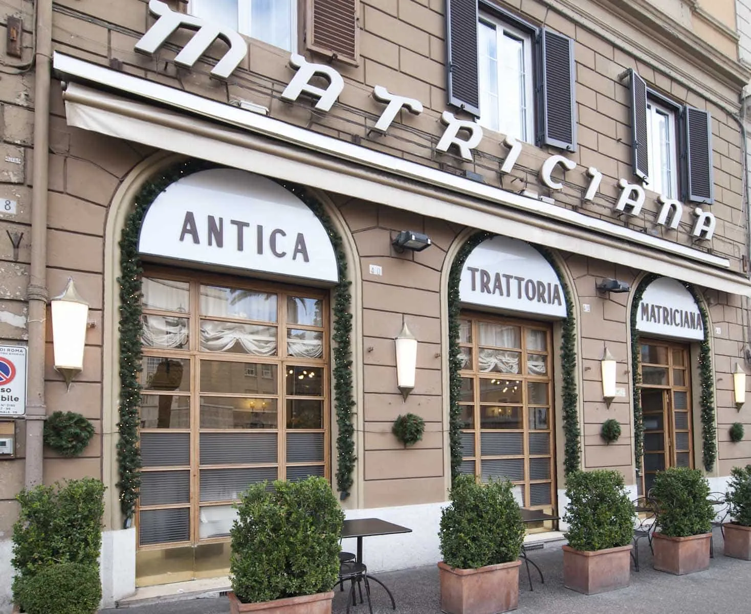 the brass lettering "Matriciana 1870" set into the doorstep of La Matriciana, or its dining room