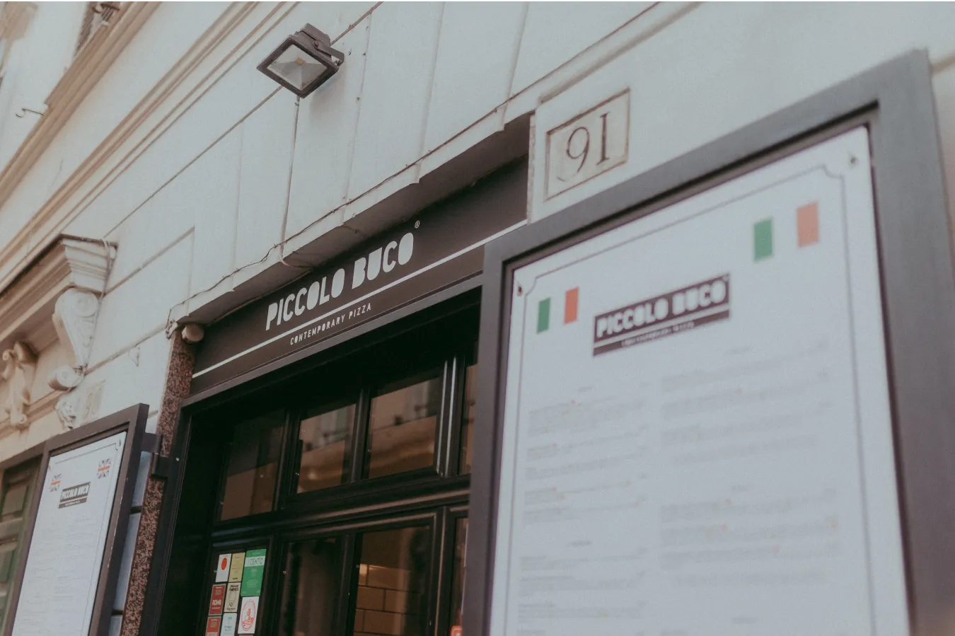 the front of Piccolo Buco on Via del Lavatore, or a pizza from its oven